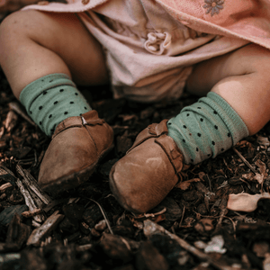baby wearing green crew socks merino wool nz