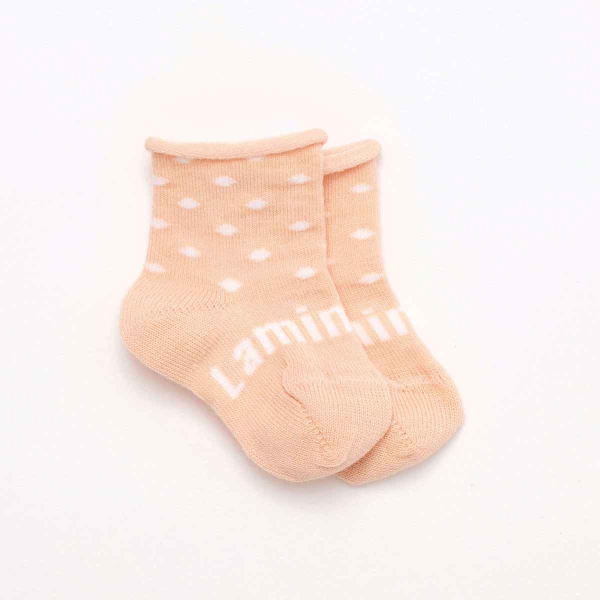 babies merino wool socks in peach with natural polka dot with roll top