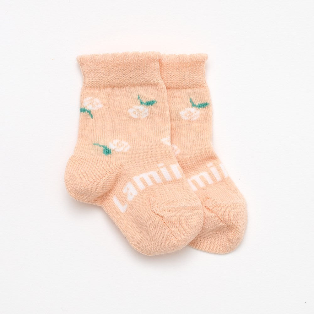 Peach with floral design and a cute frill top merino wool socks for babies NZ
