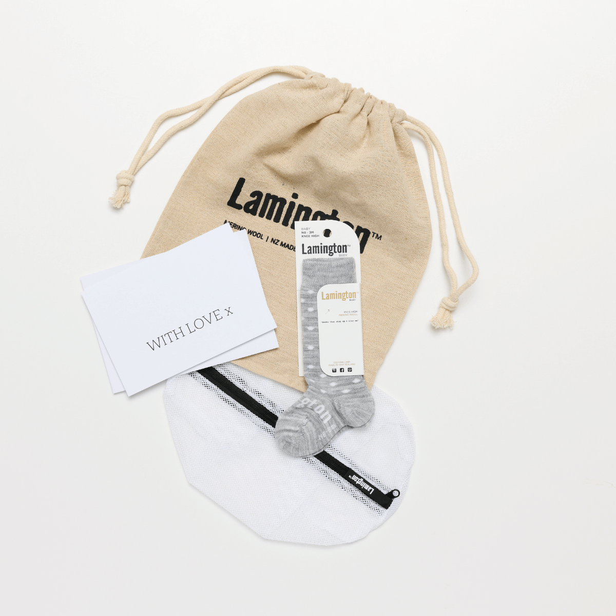 packaged gift set baby with merino socks, gift card, lamington branded laundry bag and card